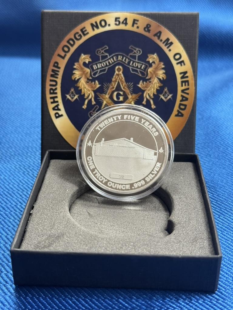 Reverse of the anniversary silver coin showing the lodge building